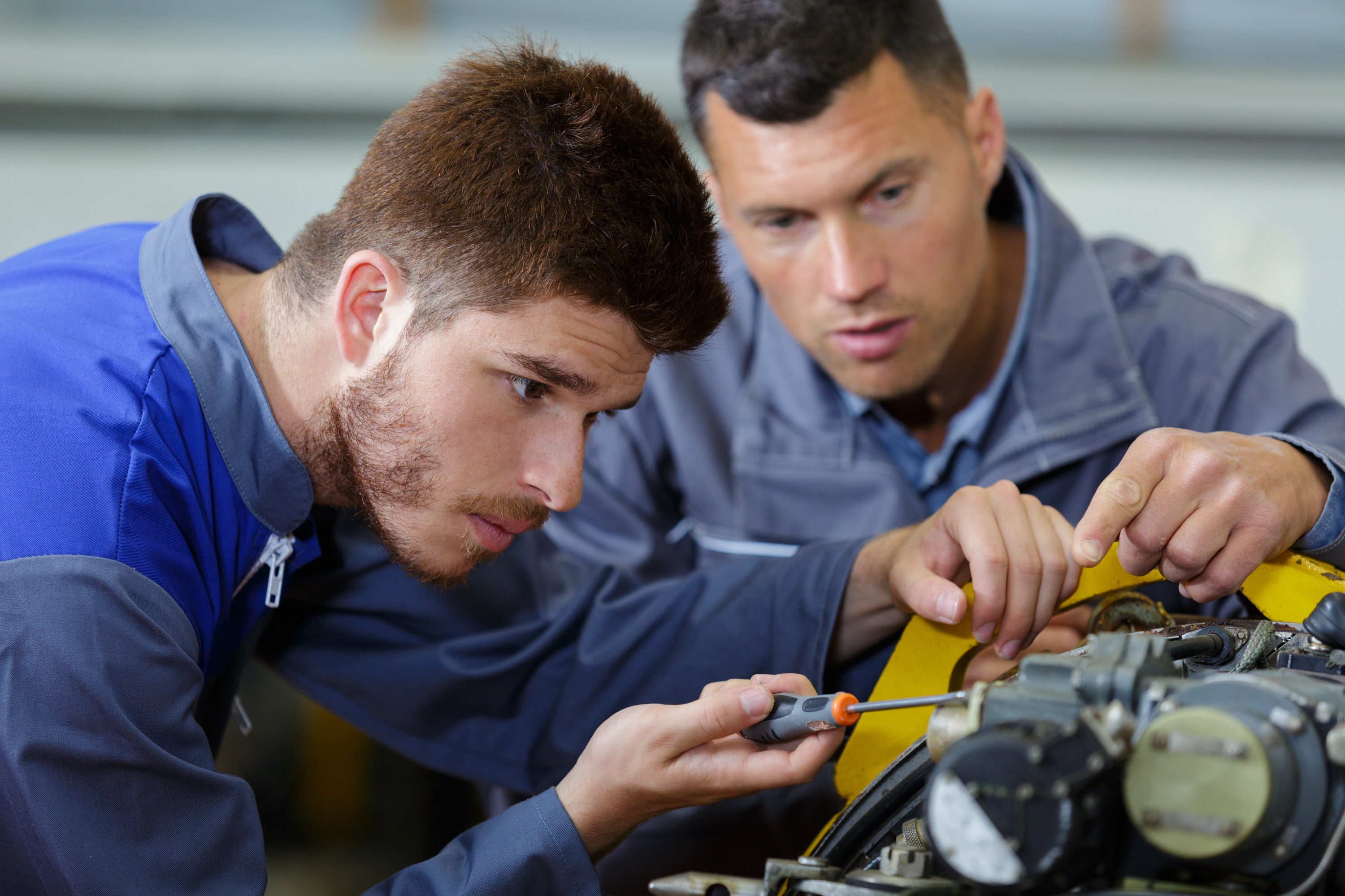 A teacher working with a further education student.